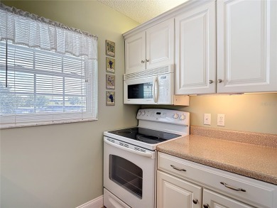 Turnkey completely furnished. Take the elevator or stairs to on Zephyrhills Municipal Golf Course in Florida - for sale on GolfHomes.com, golf home, golf lot