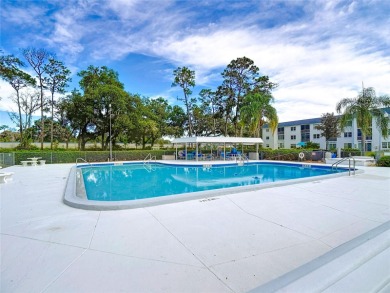 Turnkey completely furnished. Take the elevator or stairs to on Zephyrhills Municipal Golf Course in Florida - for sale on GolfHomes.com, golf home, golf lot