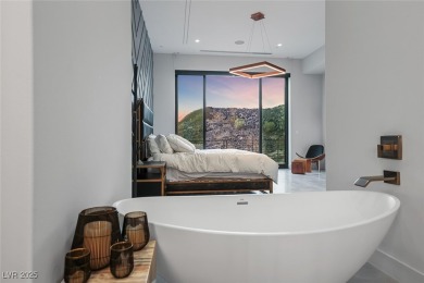 STUNNING STRIP, MOUNTAIN AND CITY VIEWS IN THIS RARE SOUGHT on Dragon Ridge Country Club in Nevada - for sale on GolfHomes.com, golf home, golf lot