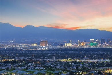 STUNNING STRIP, MOUNTAIN AND CITY VIEWS IN THIS RARE SOUGHT on Dragon Ridge Country Club in Nevada - for sale on GolfHomes.com, golf home, golf lot