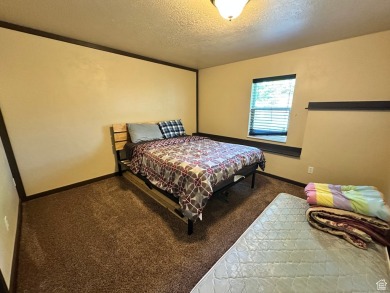 Are you looking for a family Cabin in Bear Lake? Look no further on Bear Lake West Golf and Country Club in Idaho - for sale on GolfHomes.com, golf home, golf lot