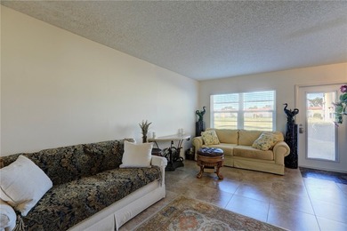 Charming first-floor condo with golf and green space views plus on The American Golf Club in Florida - for sale on GolfHomes.com, golf home, golf lot