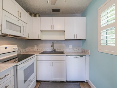 Spacious first floor condominium  in vibrant 55+ community- on Vero Beach South Golf Course in Florida - for sale on GolfHomes.com, golf home, golf lot