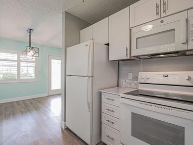 Spacious first floor condominium in vibrant 55+ community- on Vero Beach South Golf Course in Florida - for sale on GolfHomes.com, golf home, golf lot