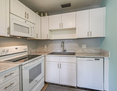 Spacious first floor condominium  in vibrant 55+ community- on Vero Beach South Golf Course in Florida - for sale on GolfHomes.com, golf home, golf lot