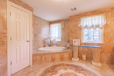 Welcome to luxury living at its finest in this beautifully on The Greens At Half Hollow in New York - for sale on GolfHomes.com, golf home, golf lot