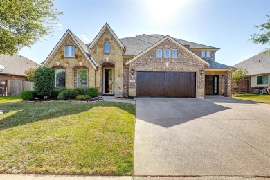 Gorgeous home with a stone & brick exterior and beautiful curb on Mansfield National Golf Club in Texas - for sale on GolfHomes.com, golf home, golf lot
