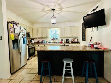 This spacious 4 (possibly 5) bedroom, 2 bathroom home is nestled on Selmer Country Club in Tennessee - for sale on GolfHomes.com, golf home, golf lot