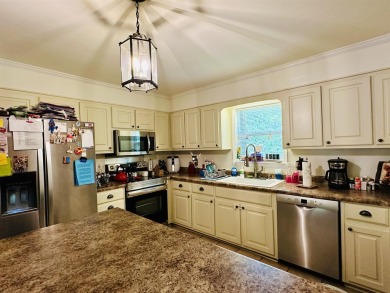 This spacious 4 (possibly 5) bedroom, 2 bathroom home is nestled on Selmer Country Club in Tennessee - for sale on GolfHomes.com, golf home, golf lot