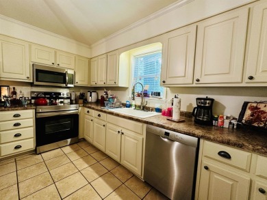 This spacious 4 (possibly 5) bedroom, 2 bathroom home is nestled on Selmer Country Club in Tennessee - for sale on GolfHomes.com, golf home, golf lot