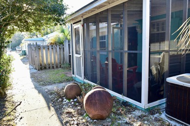 Discover relaxed coastal living in this charming cottage-style on St. James Bay in Florida - for sale on GolfHomes.com, golf home, golf lot