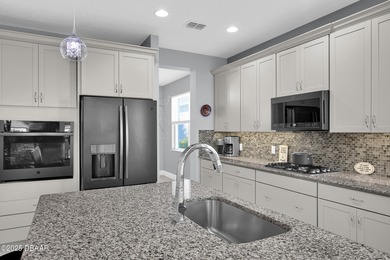 Live the laid-back dream in this vibrant Parrot model home! on LPGA International Golf Course in Florida - for sale on GolfHomes.com, golf home, golf lot