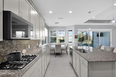 Live the laid-back dream in this vibrant Parrot model home! on LPGA International Golf Course in Florida - for sale on GolfHomes.com, golf home, golf lot