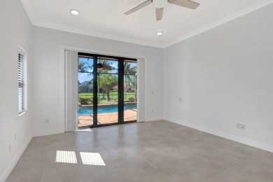 Nestled in the heart of Boca Woods Country Club, this home sits on Boca Woods Country Club in Florida - for sale on GolfHomes.com, golf home, golf lot