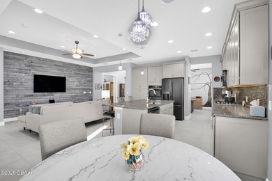 Live the laid-back dream in this vibrant Parrot model home! on LPGA International Golf Course in Florida - for sale on GolfHomes.com, golf home, golf lot