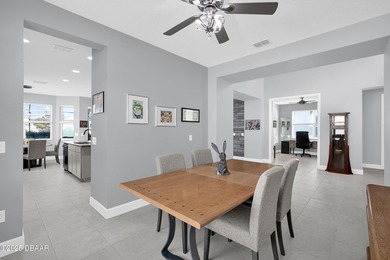 Live the laid-back dream in this vibrant Parrot model home! on LPGA International Golf Course in Florida - for sale on GolfHomes.com, golf home, golf lot