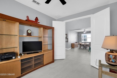 Live the laid-back dream in this vibrant Parrot model home! on LPGA International Golf Course in Florida - for sale on GolfHomes.com, golf home, golf lot