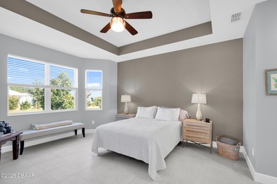 Live the laid-back dream in this vibrant Parrot model home! on LPGA International Golf Course in Florida - for sale on GolfHomes.com, golf home, golf lot