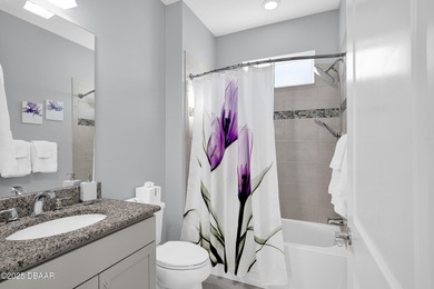 Live the laid-back dream in this vibrant Parrot model home! on LPGA International Golf Course in Florida - for sale on GolfHomes.com, golf home, golf lot