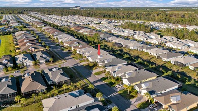 Live the laid-back dream in this vibrant Parrot model home! on LPGA International Golf Course in Florida - for sale on GolfHomes.com, golf home, golf lot