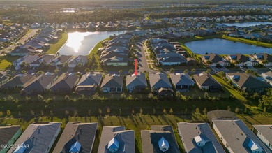 Live the laid-back dream in this vibrant Parrot model home! on LPGA International Golf Course in Florida - for sale on GolfHomes.com, golf home, golf lot