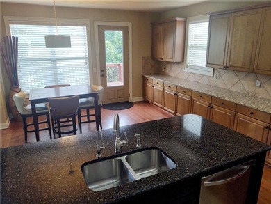 Experience luxury living in this expansive 5,300+ sq ft, 6BR/5BA on Mirror Lake Golf Club in Georgia - for sale on GolfHomes.com, golf home, golf lot