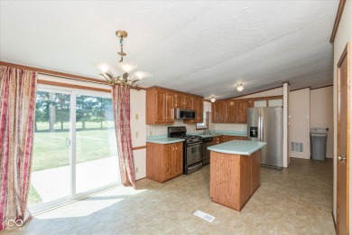 Discover your ideal retreat in this spacious 4-bedroom, 2-bath on Arrowhead Golf Course in Indiana - for sale on GolfHomes.com, golf home, golf lot