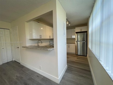 A FULLY REMODELED UNIT, IT IS BRIGHT AND HAS GREAT VIEWS on Jacaranda Golf Club in Florida - for sale on GolfHomes.com, golf home, golf lot