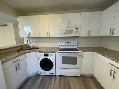 A FULLY REMODELED UNIT, IT IS BRIGHT AND HAS GREAT VIEWS on Jacaranda Golf Club in Florida - for sale on GolfHomes.com, golf home, golf lot