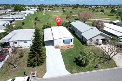 Direct golf course frontage with sweeping views from patio on Barefoot Bay Golf Course in Florida - for sale on GolfHomes.com, golf home, golf lot