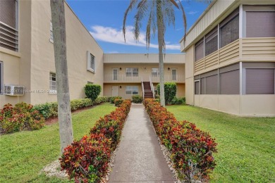 Beautifully updated 1st-floor 2-bedroom, 2-bath condo in Kings on Kings Point Golf -Flanders Way in Florida - for sale on GolfHomes.com, golf home, golf lot