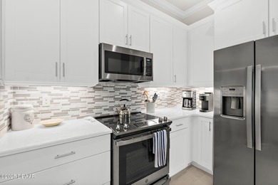 Welcome to this stunning 2-bedroom, 2-bathroom villa with a on Plantation Bay Golf and Country Club in Florida - for sale on GolfHomes.com, golf home, golf lot