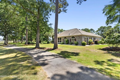 Magnificent all-brick custom home, located on a cul-de-sac on Sea Trail Golf Resort in North Carolina - for sale on GolfHomes.com, golf home, golf lot