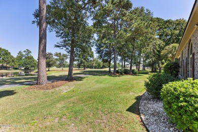 Magnificent all-brick custom home, located on a cul-de-sac on Sea Trail Golf Resort in North Carolina - for sale on GolfHomes.com, golf home, golf lot