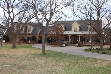 Custom 1.27 acre estate with soaring ceilings, sunroom fireplace on Nutcracker Golf Club in Texas - for sale on GolfHomes.com, golf home, golf lot