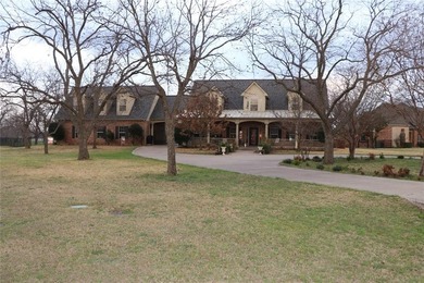 Custom 1.27 acre estate with soaring ceilings, sunroom fireplace on Nutcracker Golf Club in Texas - for sale on GolfHomes.com, golf home, golf lot
