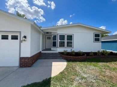 This beautifully renovated 3BED/2BATH open-concept home blends on Del Tura Golf and Country Club in Florida - for sale on GolfHomes.com, golf home, golf lot