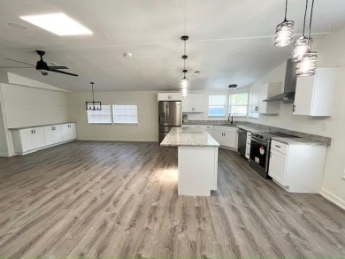 This beautifully renovated 3BED/2BATH open-concept home blends on Del Tura Golf and Country Club in Florida - for sale on GolfHomes.com, golf home, golf lot