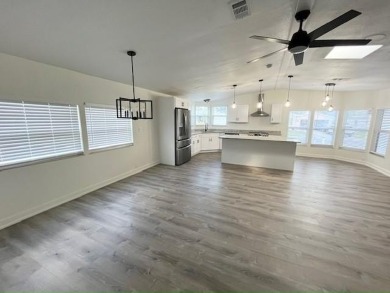 This beautifully renovated 3BED/2BATH open-concept home blends on Del Tura Golf and Country Club in Florida - for sale on GolfHomes.com, golf home, golf lot