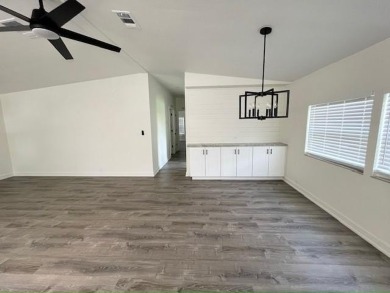 This beautifully renovated 3BED/2BATH open-concept home blends on Del Tura Golf and Country Club in Florida - for sale on GolfHomes.com, golf home, golf lot