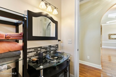 Magnificent all-brick custom home, located on a cul-de-sac on Sea Trail Golf Resort in North Carolina - for sale on GolfHomes.com, golf home, golf lot