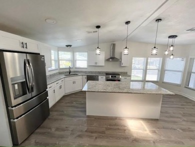 This beautifully renovated 3BED/2BATH open-concept home blends on Del Tura Golf and Country Club in Florida - for sale on GolfHomes.com, golf home, golf lot