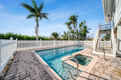 Sunset skies, pool and spa, curb appeal on a desirable on The Dunes Golf and Tennis Club in Florida - for sale on GolfHomes.com, golf home, golf lot