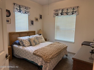 You will love this 1st floor end unit with lots of light and on St. Augustine Shores Golf Club in Florida - for sale on GolfHomes.com, golf home, golf lot
