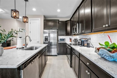Stunning new lakefront townhouse in a gated golf course on Boca Dunes Golf and Country Club in Florida - for sale on GolfHomes.com, golf home, golf lot