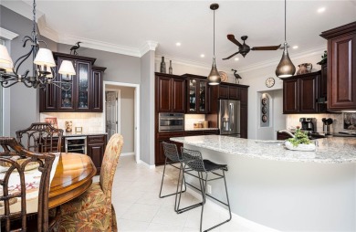 Curb appeal w/custom Landscaping, Dynamic Interior & private on Pelican Pointe Golf and Country Club in Florida - for sale on GolfHomes.com, golf home, golf lot