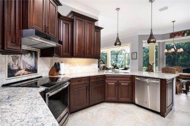 Curb appeal w/custom Landscaping, Dynamic Interior & private on Pelican Pointe Golf and Country Club in Florida - for sale on GolfHomes.com, golf home, golf lot