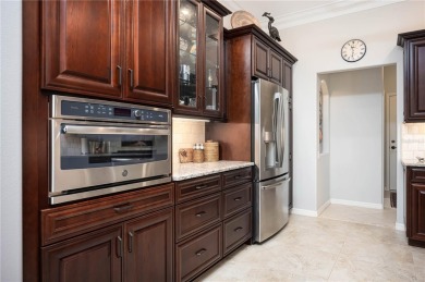 Curb appeal w/custom Landscaping, Dynamic Interior & private on Pelican Pointe Golf and Country Club in Florida - for sale on GolfHomes.com, golf home, golf lot