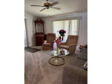 Welcome to this beautifully maintained 2/2 home where you will on Lake Henry Golf Club in Florida - for sale on GolfHomes.com, golf home, golf lot