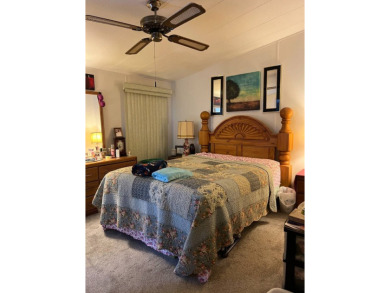 Welcome to this beautifully maintained 2/2 home where you will on Lake Henry Golf Club in Florida - for sale on GolfHomes.com, golf home, golf lot